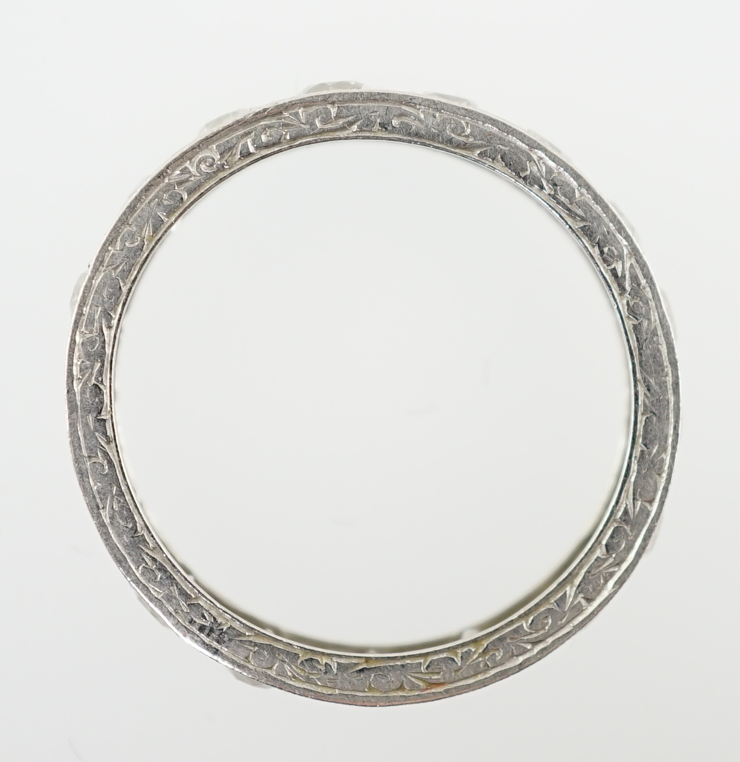 A mid 20th century platinum and diamond set full eternity ring